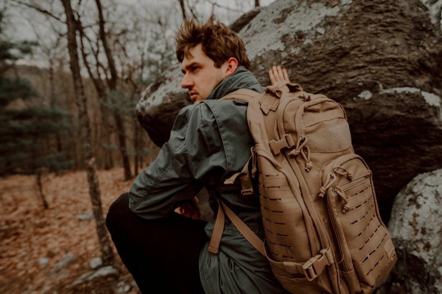 Man in the woods, with his bug out bag